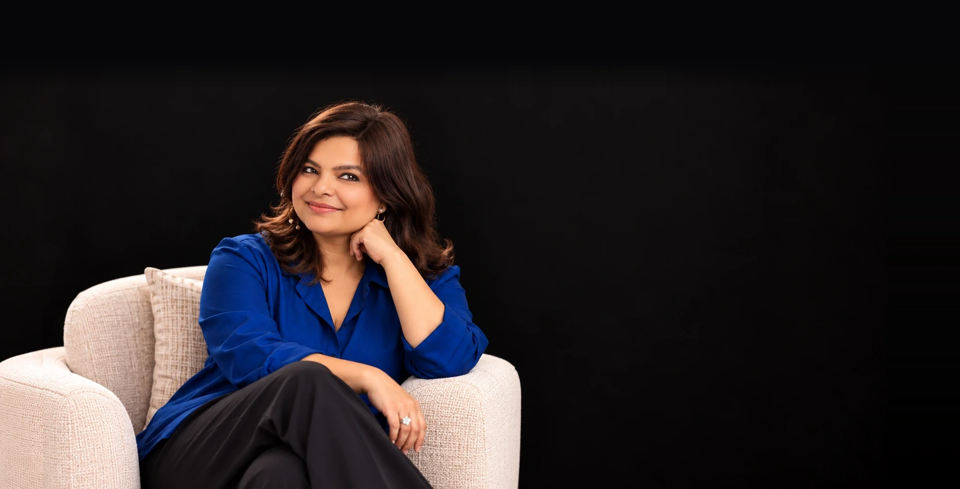 Pragya Tomar seated in an armchair